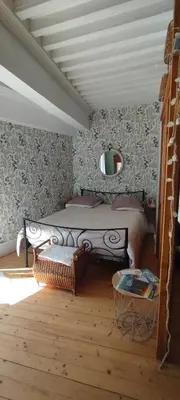Un ou plusieurs lits dans un hébergement de l'établissement Jura entre Lacs et Montagnes Charmant studio cosy de 38 m2