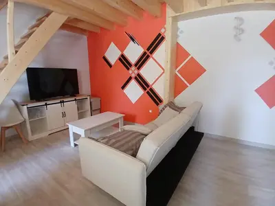 Télévision ou salle de divertissement dans l'établissement A l'Orée des Champs