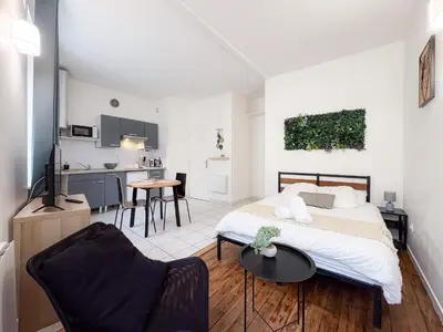 Un ou plusieurs lits dans un hébergement de l'établissement Cozy studio