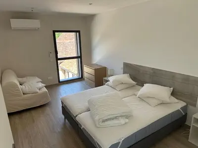 Un ou plusieurs lits dans un hébergement de l'établissement Appartement indépendant jusqu'à 10 personnes