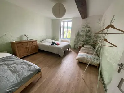 Un ou plusieurs lits dans un hébergement de l'établissement Cense des Possibles - chambre Forêt 4 personnes
