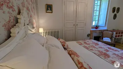 Un ou plusieurs lits dans un hébergement de l'établissement Château de Coraboeuf - Gîte de la Marquise