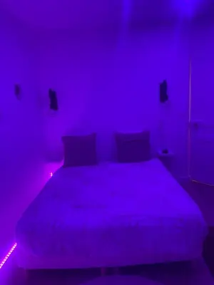 Un ou plusieurs lits dans un hébergement de l'établissement Appartement Jacuzzi proche Cité Gastronomique