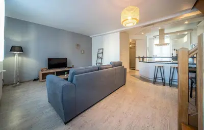 Télévision ou salle de divertissement dans l'établissement Duplex - centre-ville