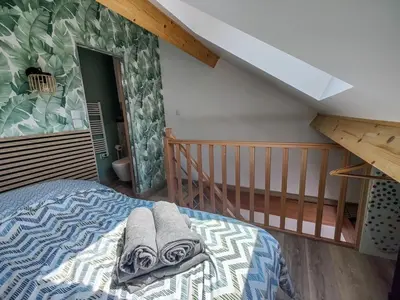 Un ou plusieurs lits dans un hébergement de l'établissement Le Gary cosy, studio climatisé, Dijon centre