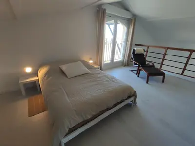 Un ou plusieurs lits dans un hébergement de l'établissement Duplex moderne, chaleureux au calme à Toison d'or