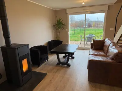 Coin salon dans l'établissement Maison neuve proche Dole - Forêt de Chaux