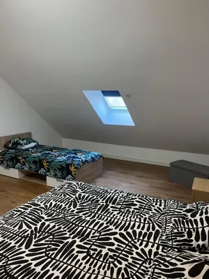 Un ou plusieurs lits dans un hébergement de l'établissement Appartement F2 de 55 m2