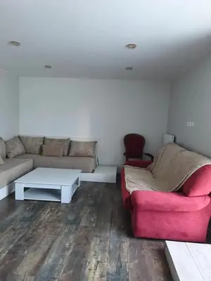 Coin salon dans l'établissement Appartement charmant à Charnay-lès-Mâcon avec jardin