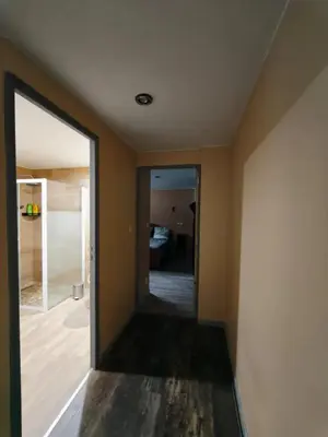 Un ou plusieurs lits dans un hébergement de l'établissement Appartement charmant à Charnay-lès-Mâcon avec jardin