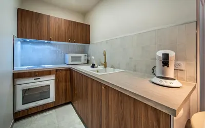 Cuisine ou kitchenette dans l'établissement Le raffiné