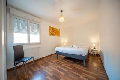 Un ou plusieurs lits dans un hébergement de l'établissement Spacieux logement près de Chalon