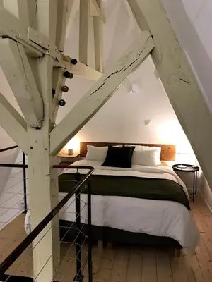Un ou plusieurs lits dans un hébergement de l'établissement Le Duplex Verrerie - Quartier des Antiquaires