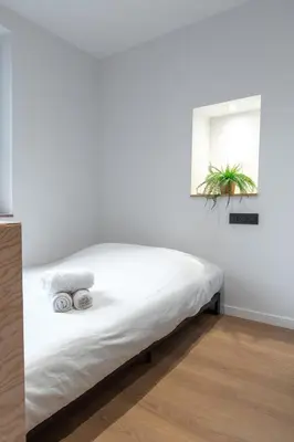 Un ou plusieurs lits dans un hébergement de l'établissement Résidence Mariotte - Le Bleu Majorelle - Appartement indépendant