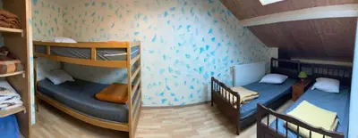 Un ou plusieurs lits dans un hébergement de l'établissement Maison 14 personnes, Arbois, Gîte du Dérochoir