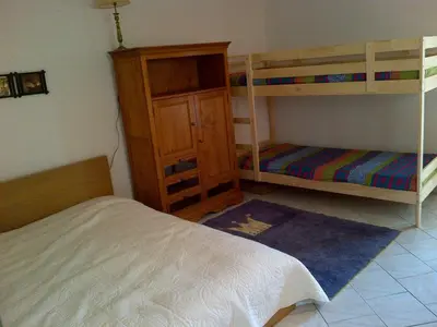 Un ou plusieurs lits dans un hébergement de l'établissement Maison Individuelle Les Templiers