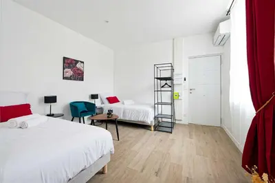 Un ou plusieurs lits dans un hébergement de l'établissement Villa Napoléon - Appart'hôtels au coeur d'Autun - Contact Hôtels