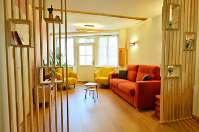 Coin salon dans l'établissement Rez de chaussée appartement à Tournus - RIMA