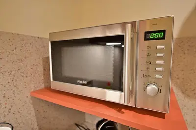 Cuisine ou kitchenette dans l'établissement Rez de chaussée appartement à Tournus - RIMA