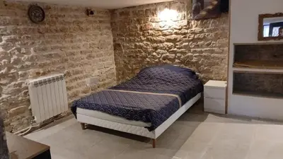 Un ou plusieurs lits dans un hébergement de l'établissement Luxury suite lilas 5
