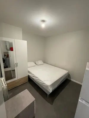Un ou plusieurs lits dans un hébergement de l'établissement Apartment with terrace and barbecue Hyper center