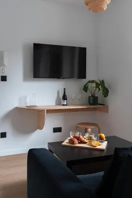 Télévision ou salle de divertissement dans l'établissement Résidence Mariotte - Le vert Kaki - Appartement Indépendant
