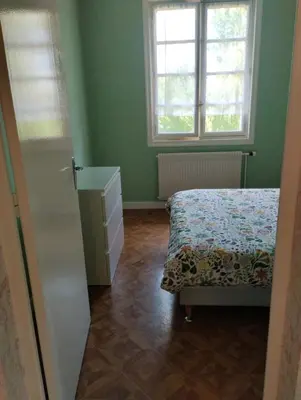 Un ou plusieurs lits dans un hébergement de l'établissement appartement avec terrasse et jardin