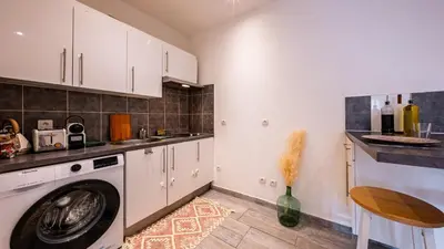 Cuisine ou kitchenette dans l'établissement Boheme Appart Cosy Centre Dijon
