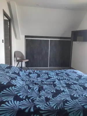 Un ou plusieurs lits dans un hébergement de l'établissement Chambres d'hôtes bord de Saône