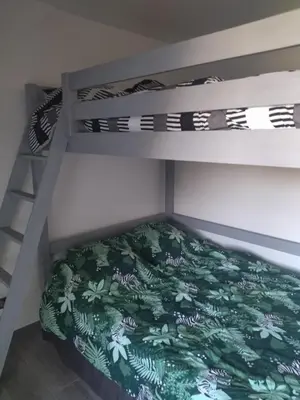 Un ou plusieurs lits dans un hébergement de l'établissement Chambres d'hôtes bord de Saône