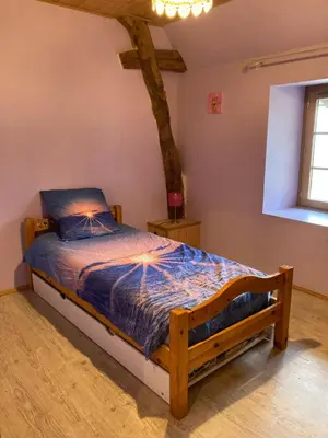 Un ou plusieurs lits dans un hébergement de l'établissement Maison à la campagne