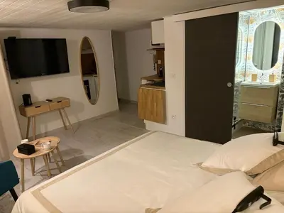 Un ou plusieurs lits dans un hébergement de l'établissement Le Ptit Saint Michel Au cœur du centre historique
