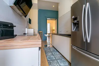 Cuisine ou kitchenette dans l'établissement Le Palais Romain - Parking inclus