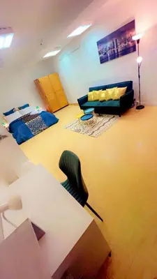Coin salon dans l'établissement Api Appartement