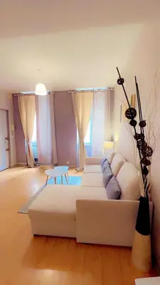 Coin salon dans l'établissement Api Appartement