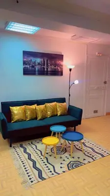 Coin salon dans l'établissement Api Appartement