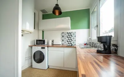 Cuisine ou kitchenette dans l'établissement Cozy apartment - Close to center