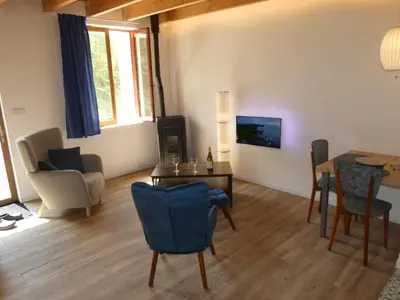 Coin salon dans l'établissement Les Girolles