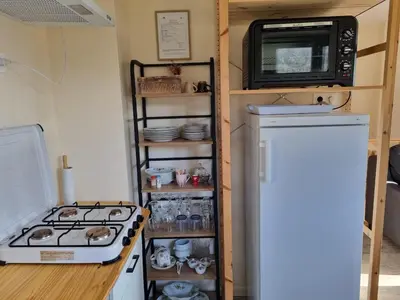 Cuisine ou kitchenette dans l'établissement Le Coquelicot, maison au calme dans le Morvan