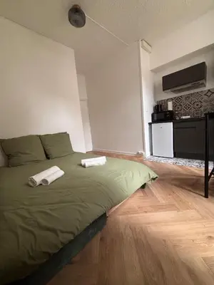 Un ou plusieurs lits dans un hébergement de l'établissement Le Balcon Dijonnais - Cours Cambronne