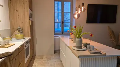 Cuisine ou kitchenette dans l'établissement Clos de Nuits Bastion du XVe siècle Studio luxe près de Beaune