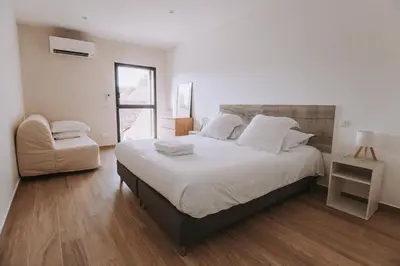 Un ou plusieurs lits dans un hébergement de l'établissement Maison et Appartement jusqu'à 24 personnes