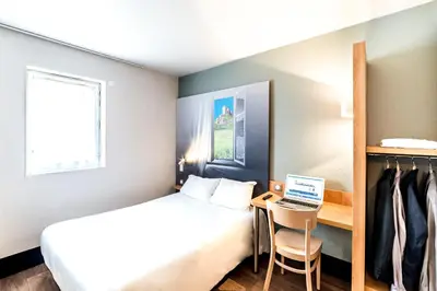 Un ou plusieurs lits dans un hébergement de l'établissement B&B HOTEL Chalon-Sur-Saone Sud