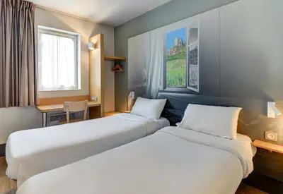 Un ou plusieurs lits dans un hébergement de l'établissement B&B HOTEL Chalon-Sur-Saone Sud
