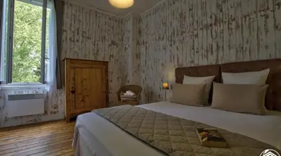 Un ou plusieurs lits dans un hébergement de l'établissement B&B Côté Moulin