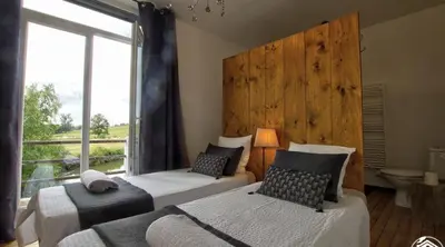 Un ou plusieurs lits dans un hébergement de l'établissement B&B Côté Moulin
