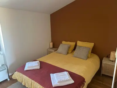 Un ou plusieurs lits dans un hébergement de l'établissement Maison au cœur des prés