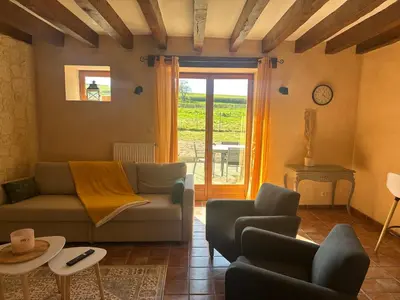 Coin salon dans l'établissement Maison au cœur des prés