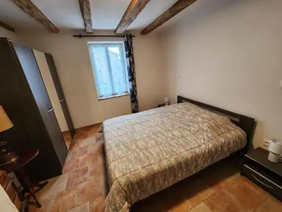 Un ou plusieurs lits dans un hébergement de l'établissement La maison bleue