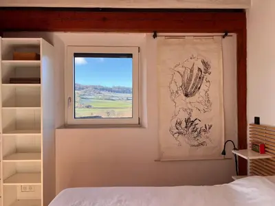 Un ou plusieurs lits dans un hébergement de l'établissement Maison éco-architecturale avec studio de yoga - 5 minutes de Cluny